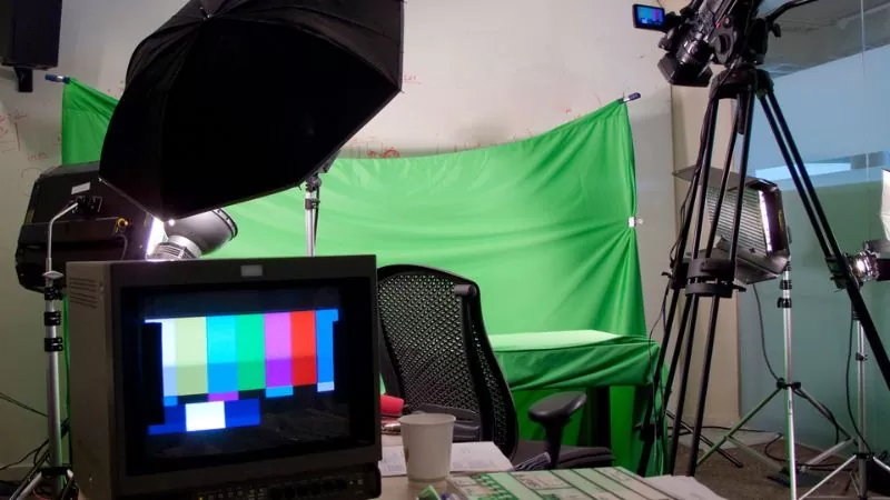 green screen behind of chair and studio setup for making video